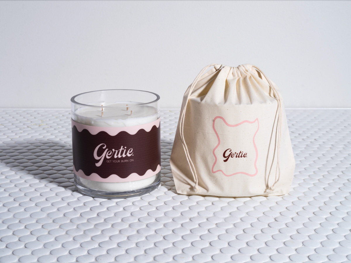 Gertie Cherry Vanilla 1.2kg Candle and drawstring bag on a textured surface