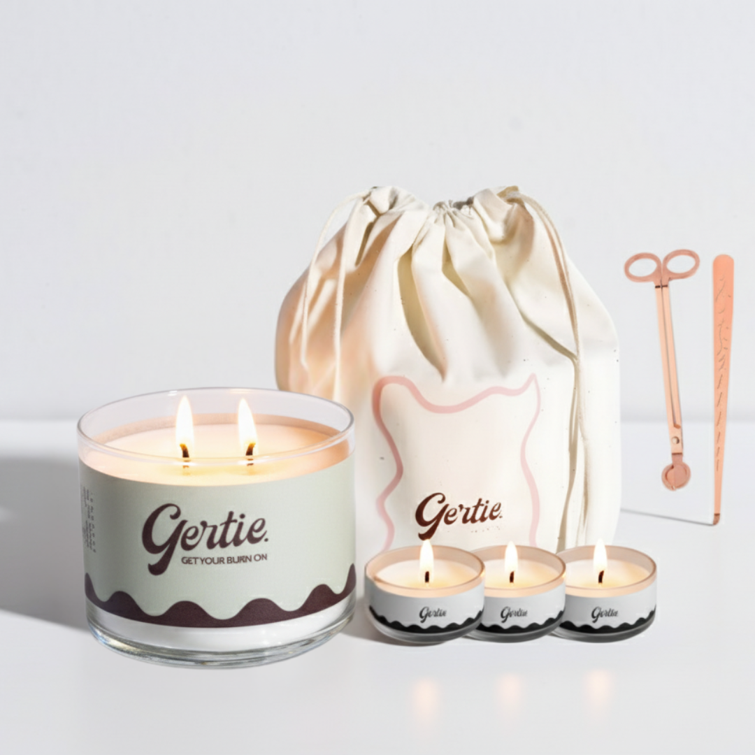 Gertie candle set with a large candle, three small candles, and a drawstring bag on a light background.