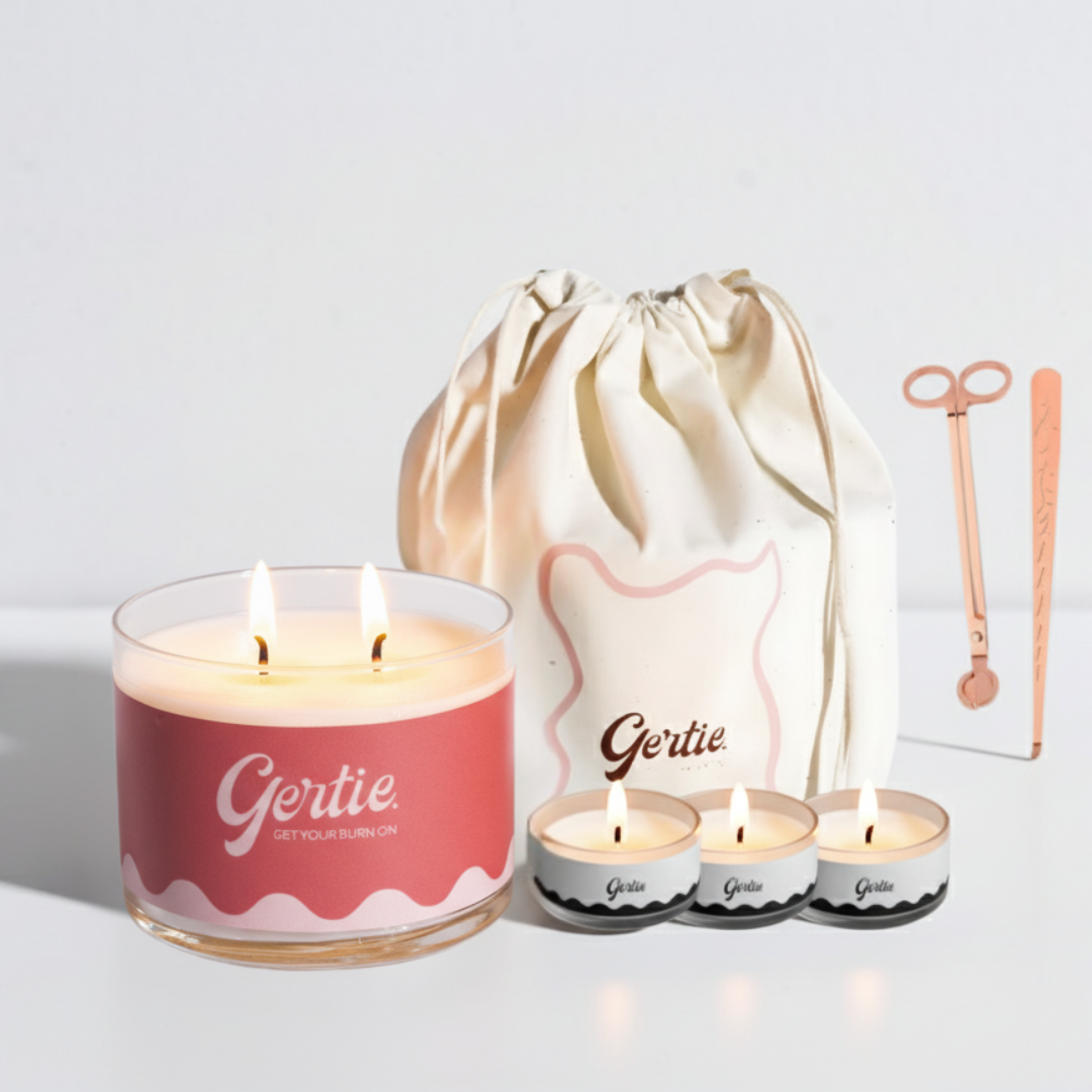 Gertie candle set with a large candle, three smaller candles, and a drawstring bag on a light background.