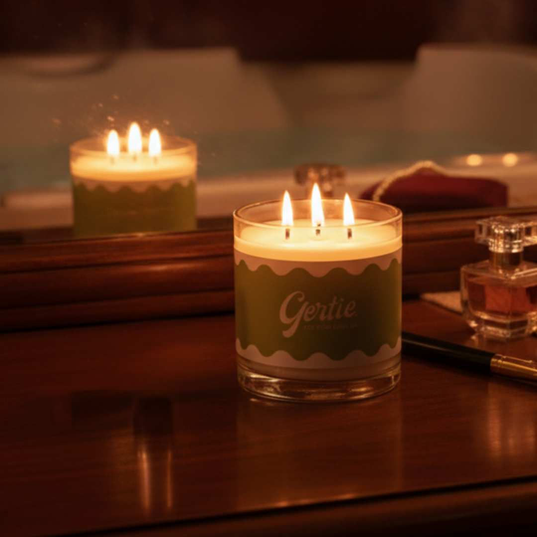 One lit candle on a wooden surface with a blurred background