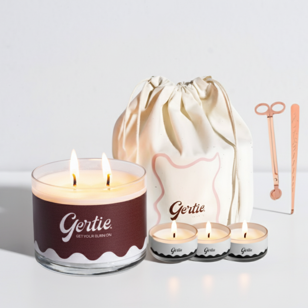Gertie candle set with a large candle, three small candles, and a drawstring bag on a light background.