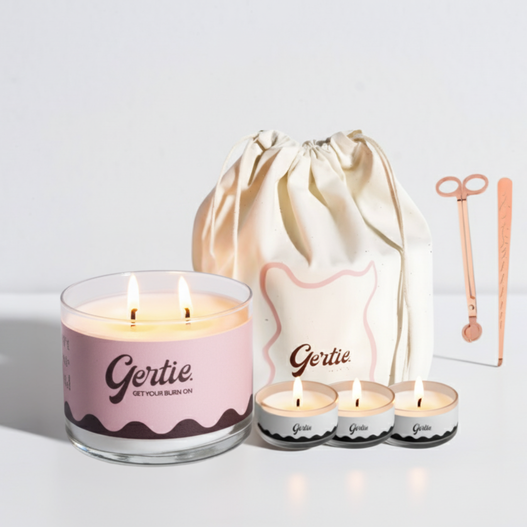 Gertie candle set with a large candle, three small candles, and a drawstring bag on a light background.