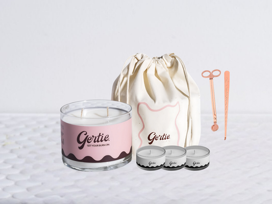 Gertie candle bundle with a drawstring bag with trimmer and dipper on a light background