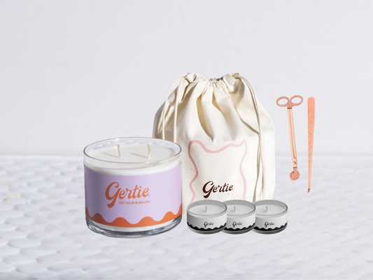 Gertie candle bundle with a drawstring bag with trimmer and dipper on a light background