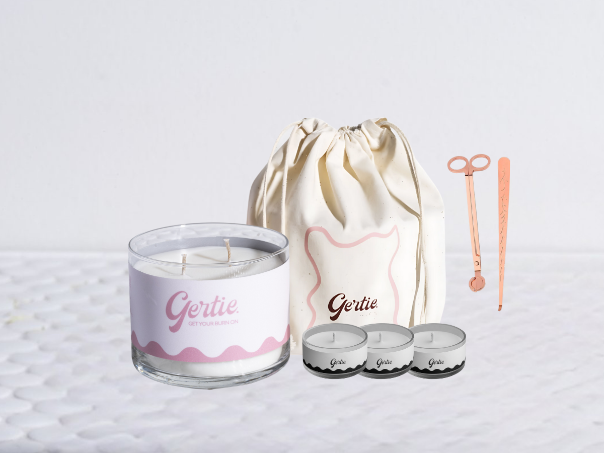 Gertie candle bundle with a drawstring bag with trimmer and dipper on a light background