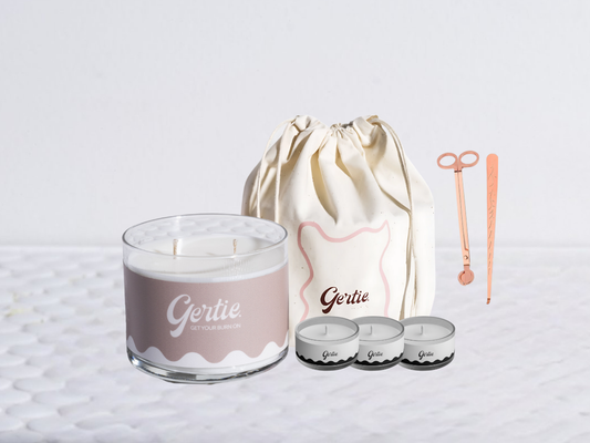Gertie candle bundle with a drawstring bag with trimmer and dipper on a light background