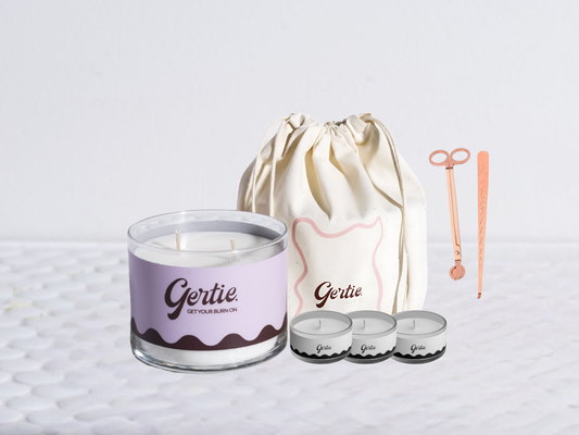 Gertie candle bundle with a drawstring bag with trimmer and dipper on a light background