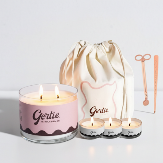Gertie candle set with a large candle, three small candles, and a drawstring bag on a light background.