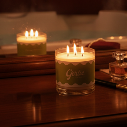 One lit candle on a wooden surface with a blurred background