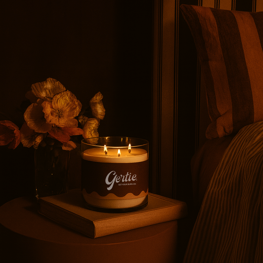 Gertie Candle in a dim  bedroom